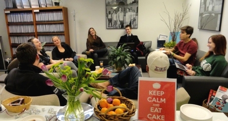 Honors students enjoying cake and conversation at the Honors Office in Hughes Hall.